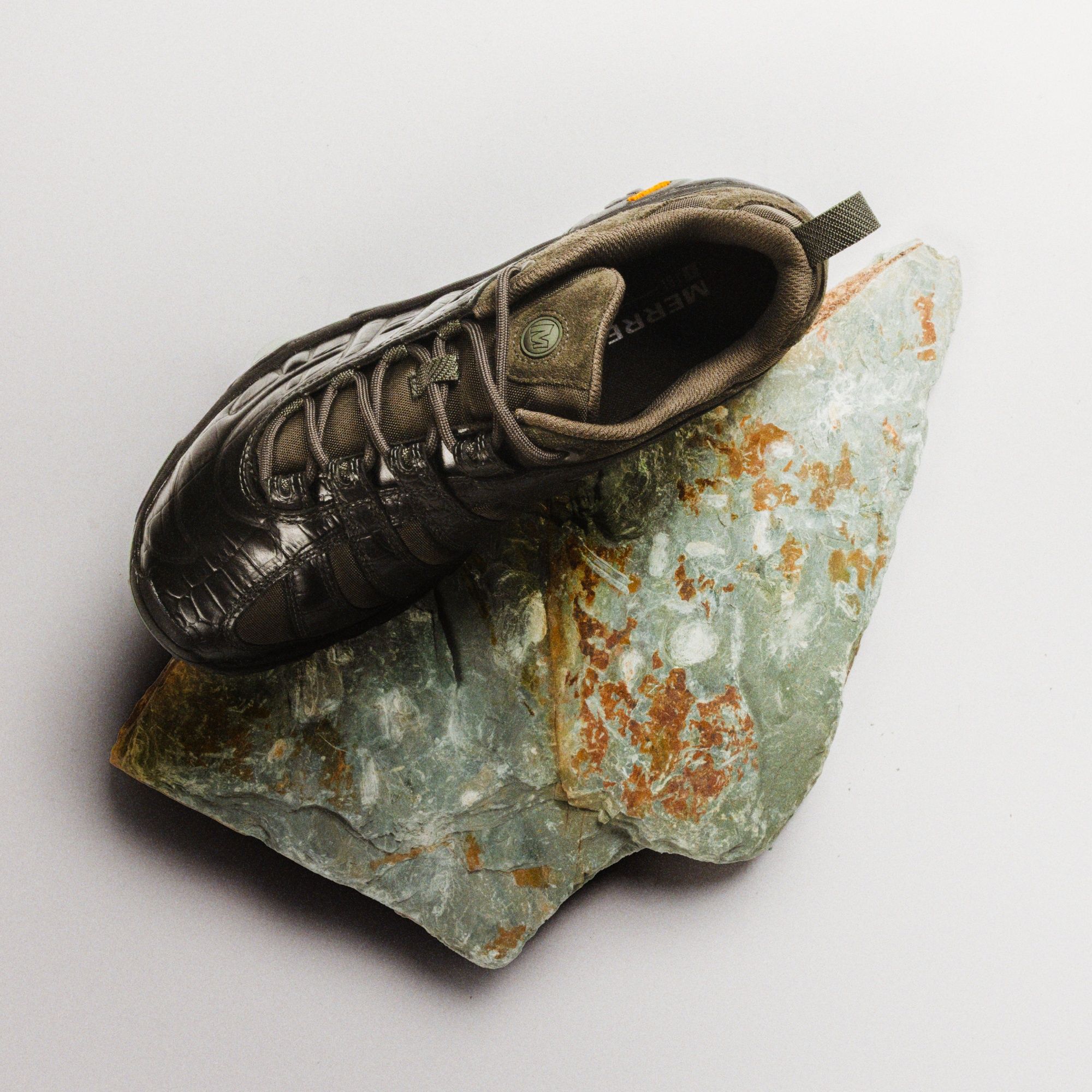 Merrell 1TRL Moab 2 Remix RPT shoe resting on a rock.